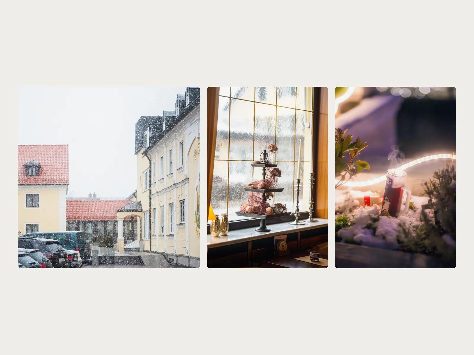 Hotelfassade im Schneefall, Etagere am Fenster und Weihnachtsdeko